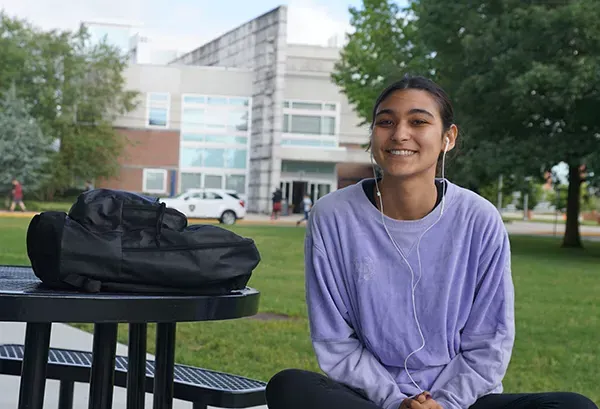 female college student sitting on 365球赛平台 campus